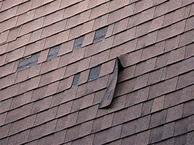 Roofing contractor fixing roof through an insurance claim.