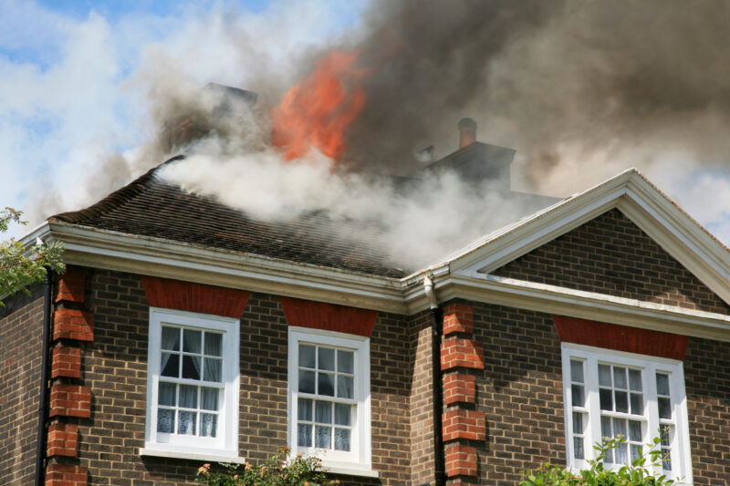 House with flame burning the roof